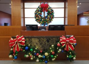 Front desk showing Christmas display can also include candy canes.