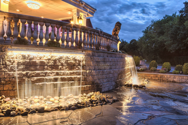 Captivating water feature and enchanting lighting accentuating the commercial property