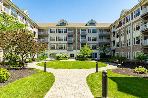 Frontal view of apartment complex with circle walkway